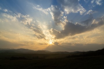 Sunrise or sunset over the hills and meadow. Slovakia