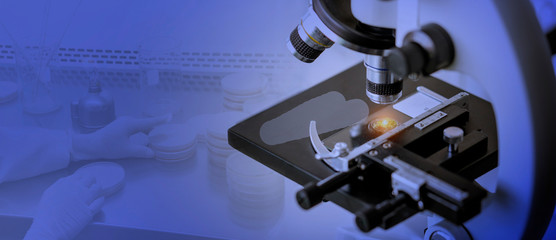 Laboratory concept; Close-up shot of microscope with blurred background of microbiology testing