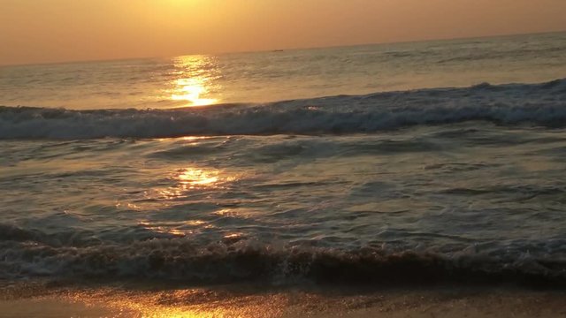 4K Sunrise over tropical island beach and palm trees. Phuket beach sea, View of beach sea on sun light in the summer. Colorful sunset over the beach in the tropical beach sea,the tropical paradise bea
