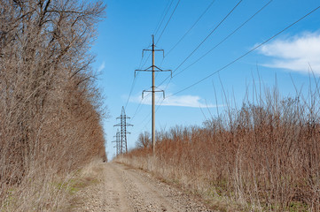 Electricity transmission power lines. The high voltage towers.