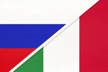 Russia vs Italy national flag from textile. Relationship and partnership between two countries.
