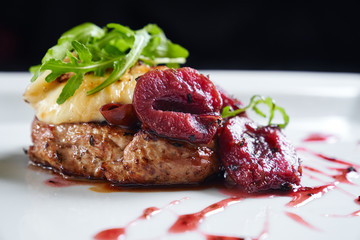 Beef served with plums, mozzarella and rucola.