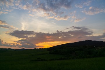 Sunrise or sunset over the hills and meadow. Slovakia