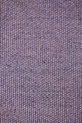 The surface texture of a natural Mat (straw, rope, or other natural material).