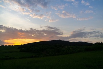 Sunrise or sunset over the hills and meadow. Slovakia