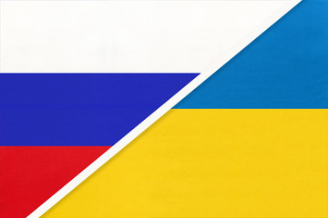 Russia vs Ukraine national flag from textile. Relationship and partnership between two countries.