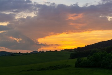 Sunrise or sunset over the hills and meadow. Slovakia