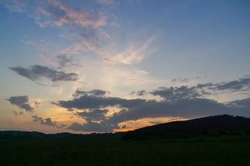 Sunrise or sunset over the hills and meadow. Slovakia