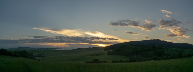 Naklejka na ściany i meble Sunrise or sunset over the hills and meadow. Slovakia