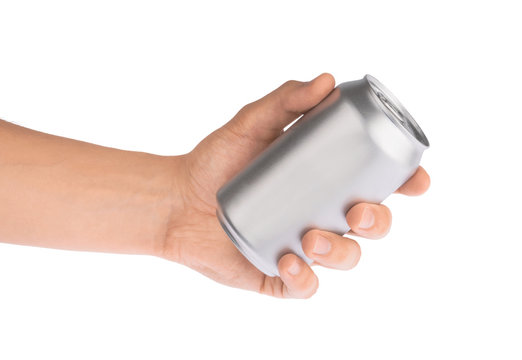 Hand holds metal beverage drink can isolated on white clipping path
