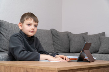 Distance learning online education. Coronavirus Epidemic. Isolated child Quarantined at Home in mask. Distance education and learning. Self isolation, home quarantine. World Crisis COVID-19