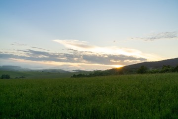 Sunrise or sunset over the hills and meadow. Slovakia