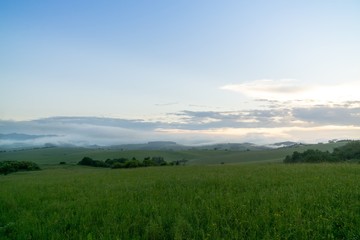 Fototapeta premium Sunrise or sunset over the hills and meadow. Slovakia