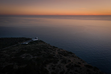 Obraz premium Faro y puesta de sol