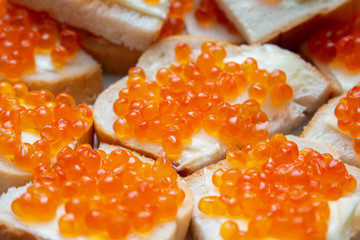 sandwiches with red caviar and butter close up