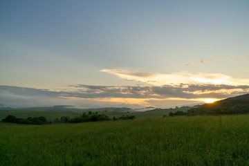 Sunrise or sunset over the hills and meadow. Slovakia
