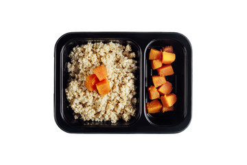 Healthy lunch at workplace. Take away meals in black containers with cutlery on gray table