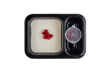 Healthy lunch at workplace. Take away meals in black containers with cutlery on gray table