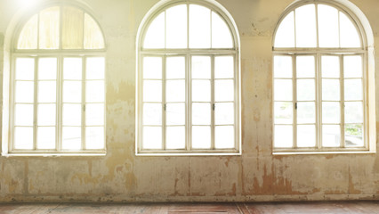 Fototapeta premium .Industrial vintage interior with bright light coming through windows. - Image