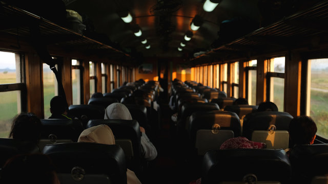 many people sit on local train to travel.copy space