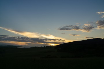 Sunrise or sunset over the hills and meadow. Slovakia