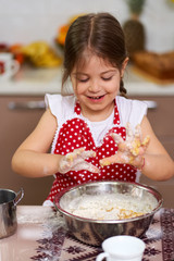 Young girl cooking a pastry