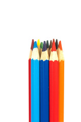 many colorful wooden crayons isolated on the white background