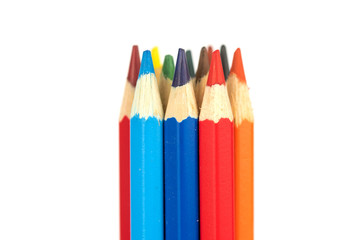 many colorful wooden crayons isolated on the white background