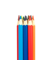 many colorful wooden crayons isolated on the white background