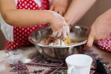 Young girl and her mom cooking