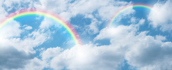 rainbow in blue sky. © natara
