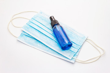 Mask and sanitizer isolated on white background