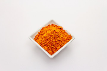 Hungarian hot paprika powder isolated on white background