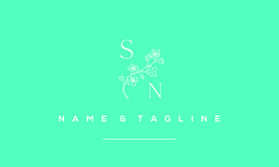 Alphabet letter icon logo SN with a floral in the middle