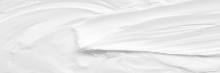 Obraz premium Cream texture for skin nourishment for good skin health Lotion Cosmetics Full frame Background Abstract texture Longitudinal Panorama High resolution.