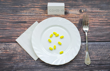 Tablets in plates on a wooden table