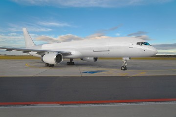 Fototapeta na wymiar Cargo plane at an airport blank white livery
