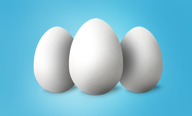 White Easter eggs on blue pastel background. Happy Easter concept. 