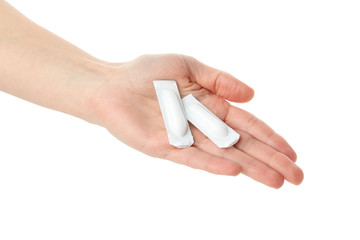 Hand with anal or vaginal candles, isolated on white background