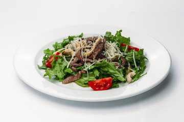 salad with egg on a plate on a white background