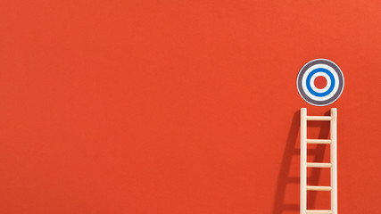Front view of circular target with ladder and copy space