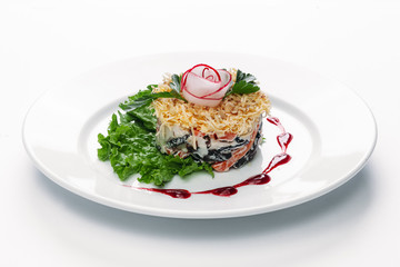 salad on a plate with radish decoration on a white background