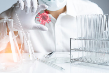 Coronavirus Concept. Close up hands holding Corona virus 3D in lab.