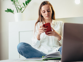 Girl learns, works, self-develops online while sitting at home