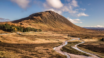 Dry autumn valley with river and mountain