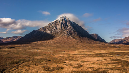 Autumn valley with dry grass and beautiful mountain aerial view