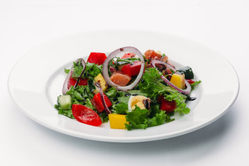 green salad on a white plate