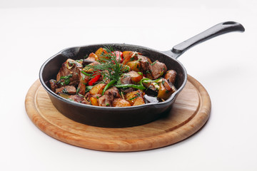 frying on a pan and a white background