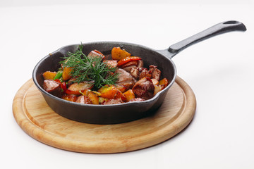 frying on a pan and a white background