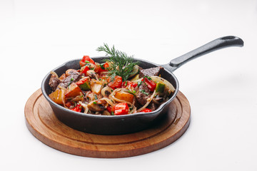 frying on a pan and a white background